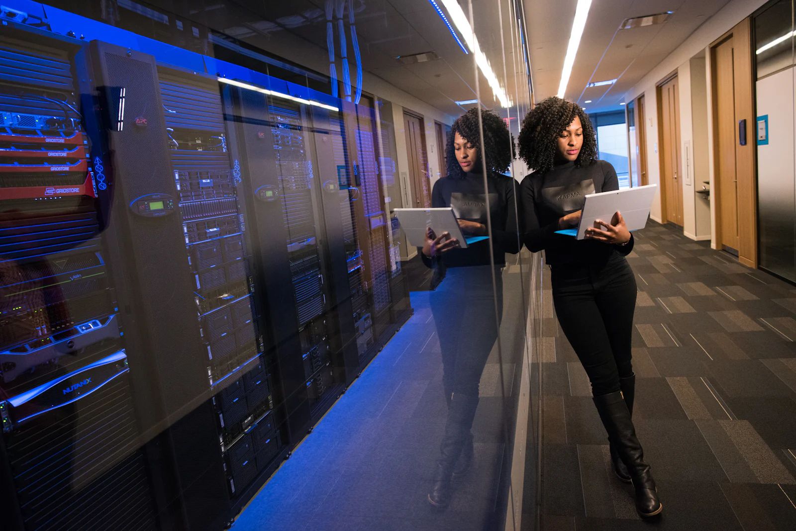 Two buyers reviewing contracts on a laptop